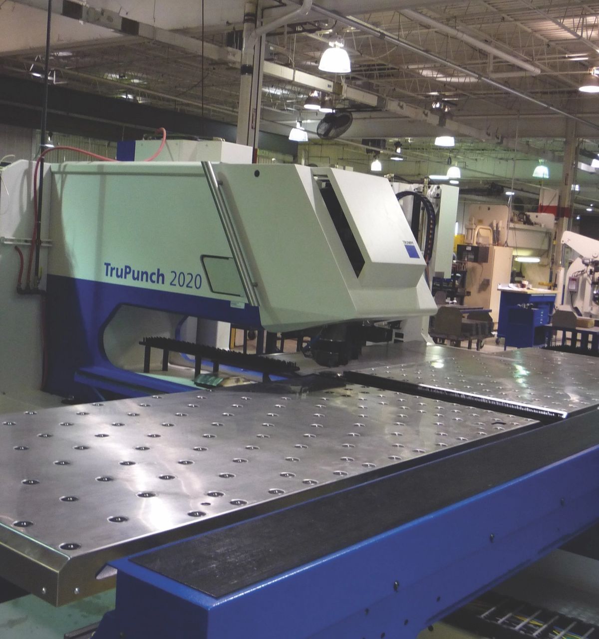 TruPunch 2020 punch press with a long perforated work table on the factory floor