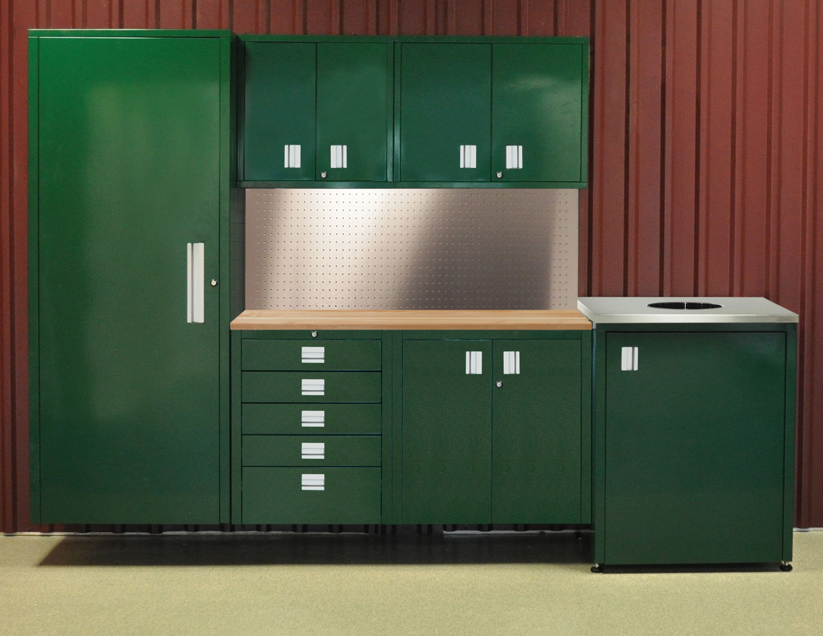 Green powder-coated steel storage system with tall locker, upper cabinets, drawers and a stainless backsplash