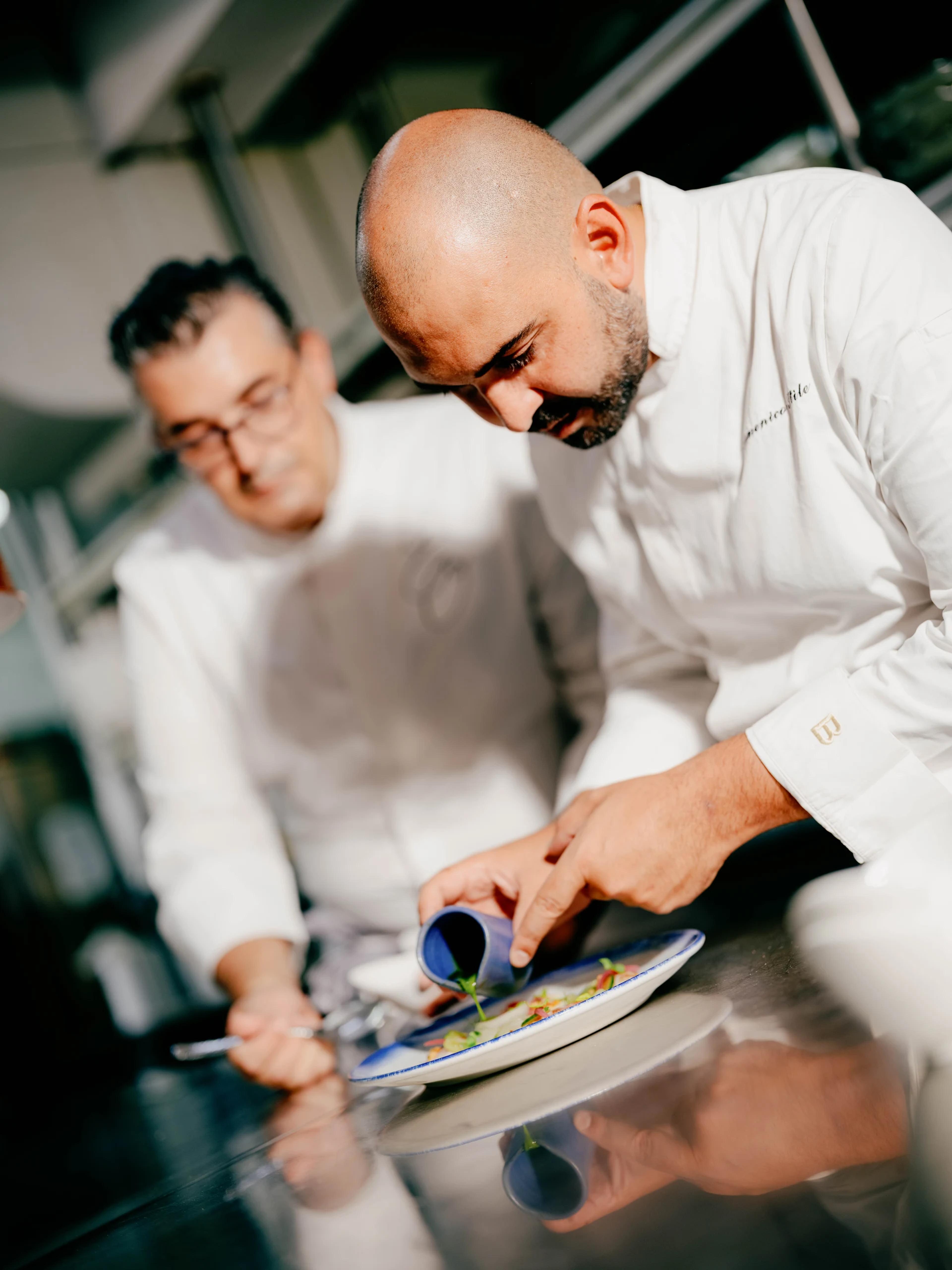 Domenico Stile plating in the kitchen with Emanuele Olivero