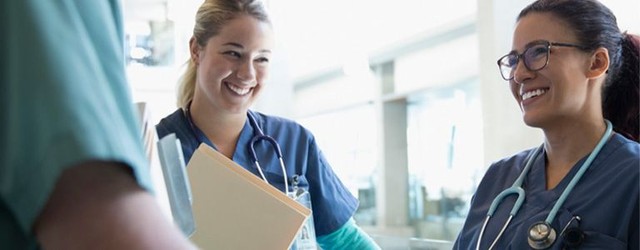 Two nurses talking before their shift.