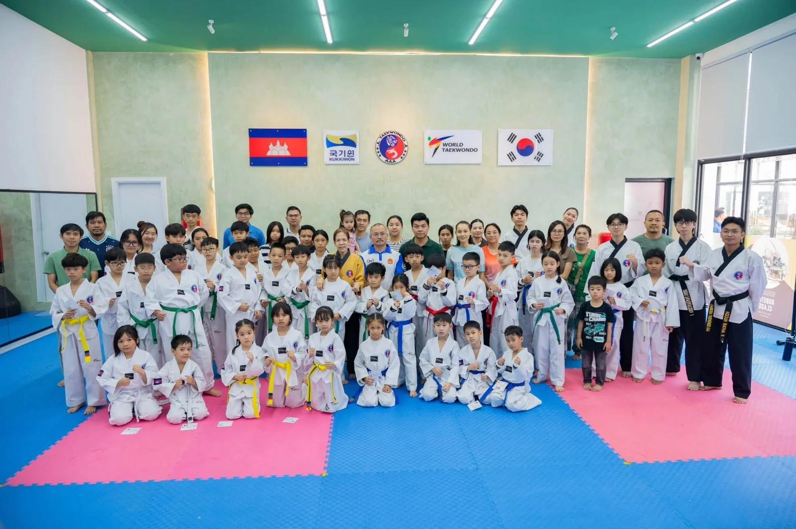 AAA students, families and coaches at a Taekwondo grading in August 2026.