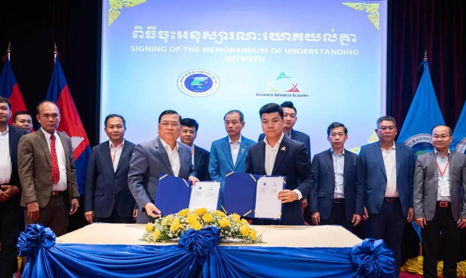 Representatives of AAA School and CHEA at the memorandum of understanding signing.