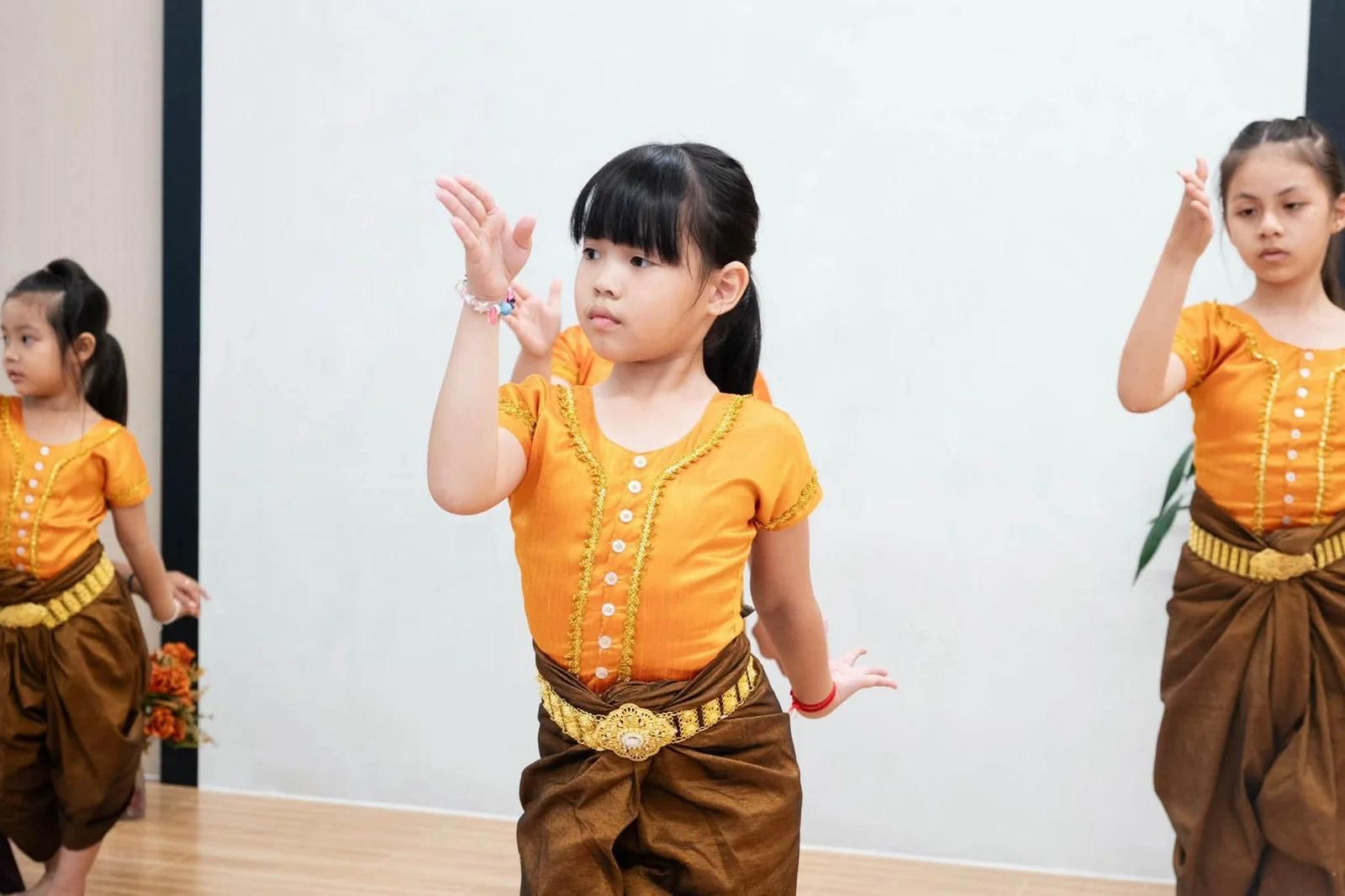 Young dancers practise traditional Khmer hand movements at Chip Mong 271.