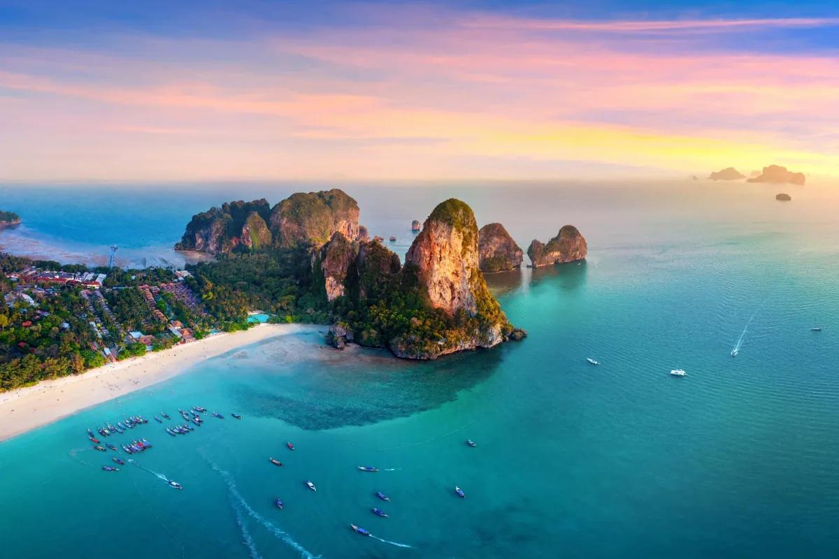 Aerial view of Railay beach and its limestone headlands at sunset, Krabi