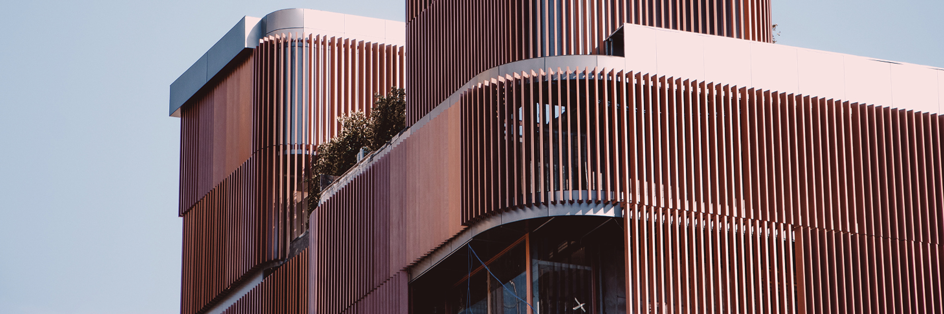 View of a modern house with a wooden facade.