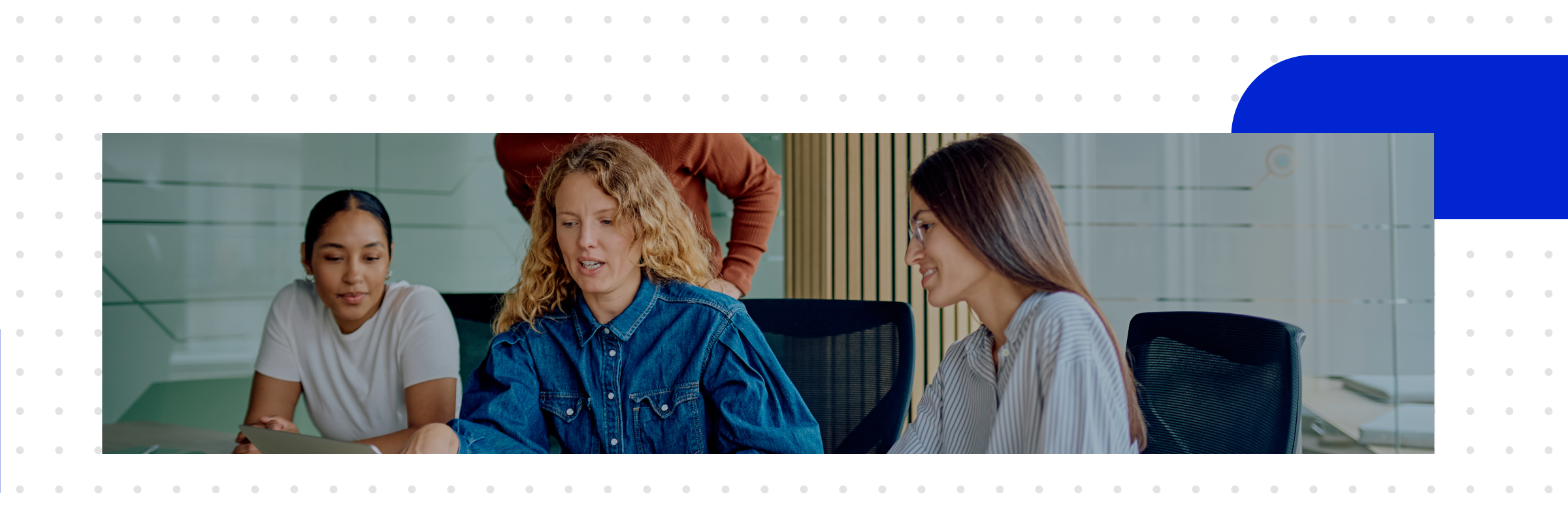 A team discusses in the office, comparing Salesforce and SAP side by side on a laptop