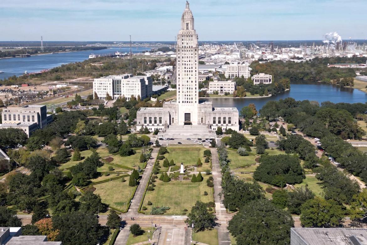 Aerial view of Louisiana State Capitol building with surrounding business district, symbolizing the intersection of government policy and commercial interests