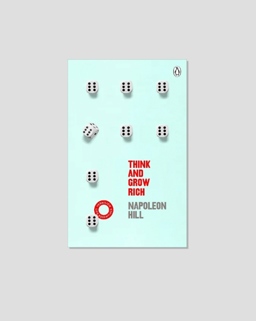 The book cover for Napoleon Hill's "Think and Grow Rich" features eight white dice, mostly showing six pips, on a light blue background with the title in red.