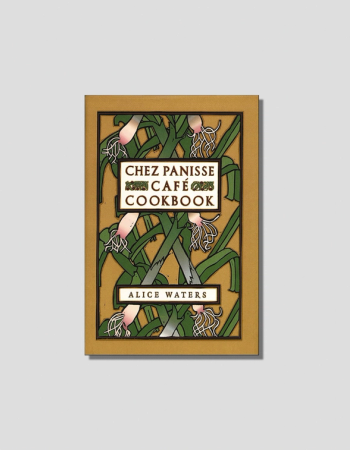 Cover of "Chez Panisse Café Cookbook" by Alice Waters, featuring an Art Nouveau illustration of root vegetables and green leaves on a gold background.