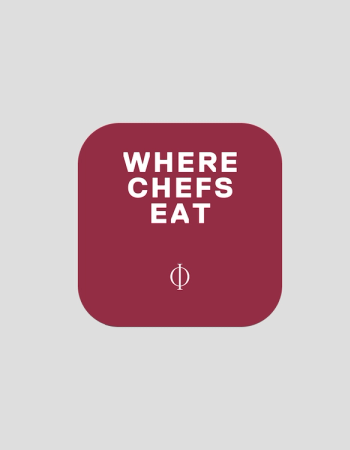 A maroon rounded square on a gray background displays "WHERE CHEFS EAT" in white text, with a white Phi symbol below.