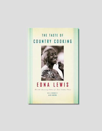 Book cover for "The Taste of Country Cooking" by Edna Lewis, featuring a smiling portrait of the author.