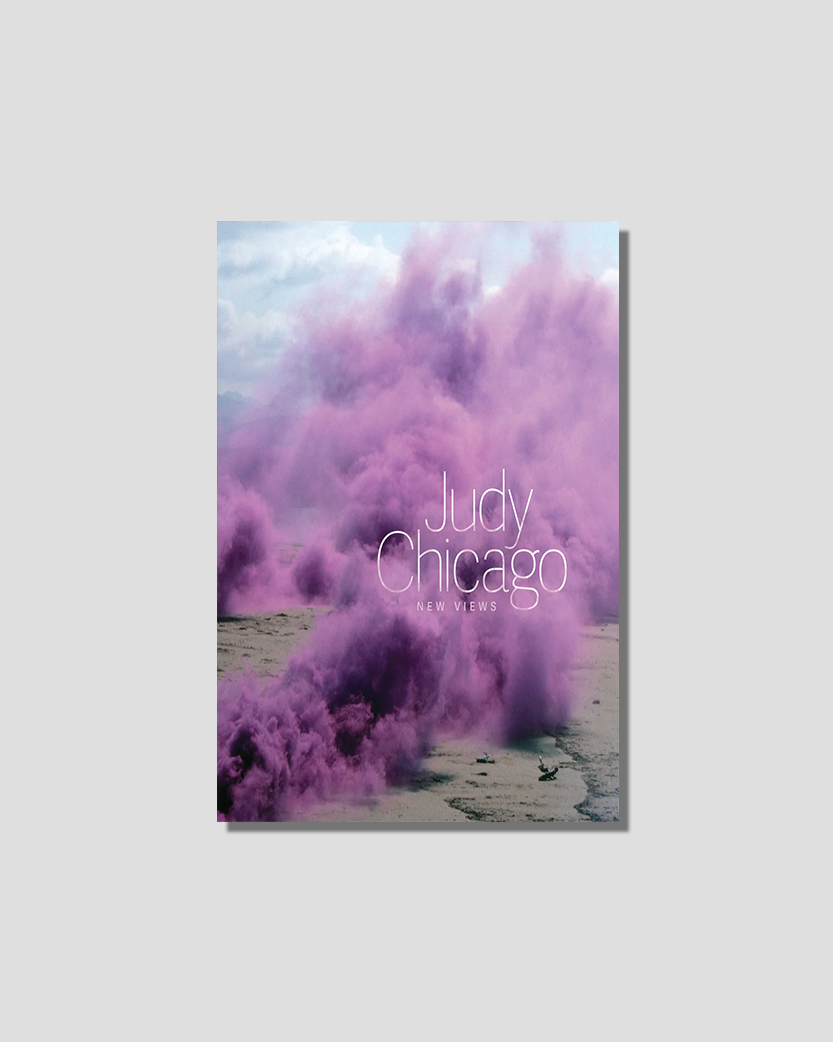 Book cover for Judy Chicago: New Views, featuring dense purple smoke against a muted landscape.