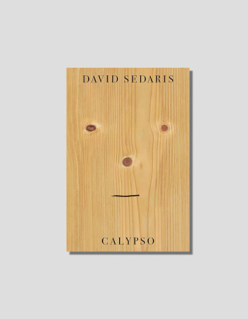 Book cover for David Sedaris's Calypso, featuring a light wood plank with knots arranged as eyes and nose, and a drawn line for a mouth.