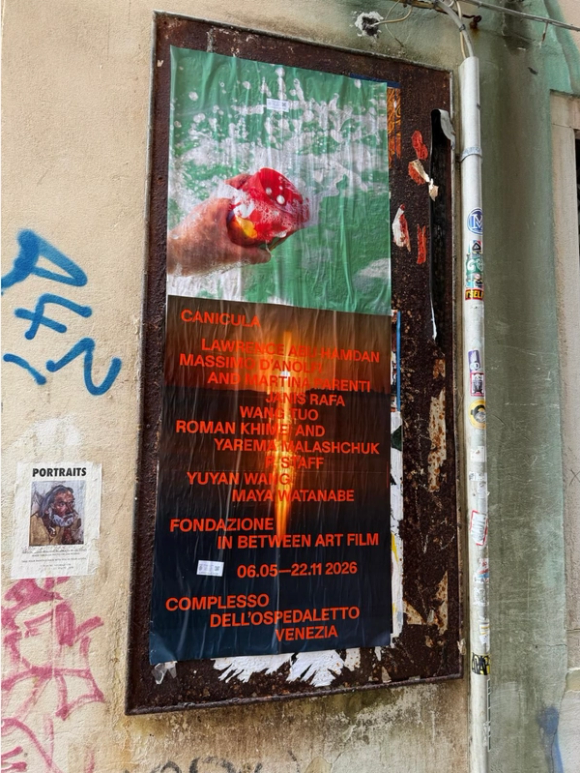 A weathered art poster titled "CANICULA" features a hand holding a red sponge against a green, splattered background, affixed to a rusty metal frame on a graffiti-covered wall in Venice.