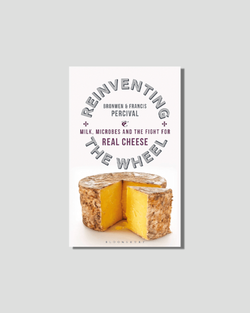 Book cover for "Reinventing the Wheel: Milk, Microbes and the Fight for Real Cheese" by Bronwen & Francis Percival, showing a wheel of yellow cheese with a slice removed.