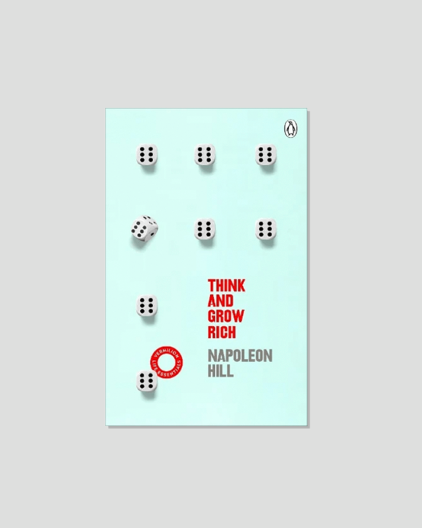 Book cover for "Think and Grow Rich" by Napoleon Hill, featuring white dice on a light blue background.
