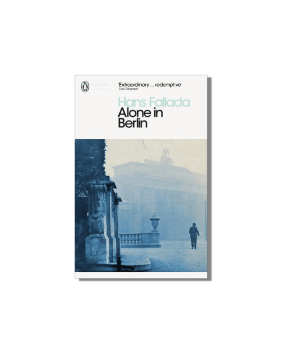 Book cover for "Alone in Berlin" by Hans Fallada, showing a blue-toned photo of a man walking away in a misty city scene with the Brandenburg Gate in the background.