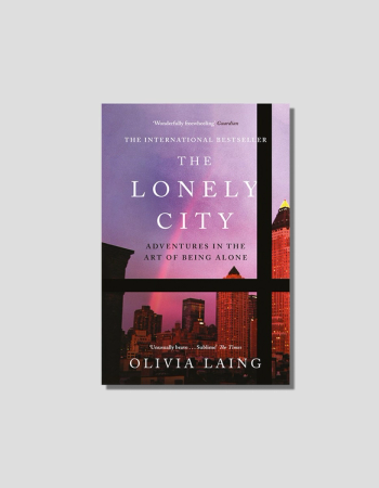 Book cover for "The Lonely City" by Olivia Laing, featuring a purple and pink cityscape viewed through a window.