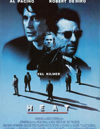 A blue-tinted movie poster for "Heat" featuring large images of Al Pacino and Robert De Niro, with a smaller image of Val Kilmer holding a gun, and five silhouetted men in suits walking below the title.