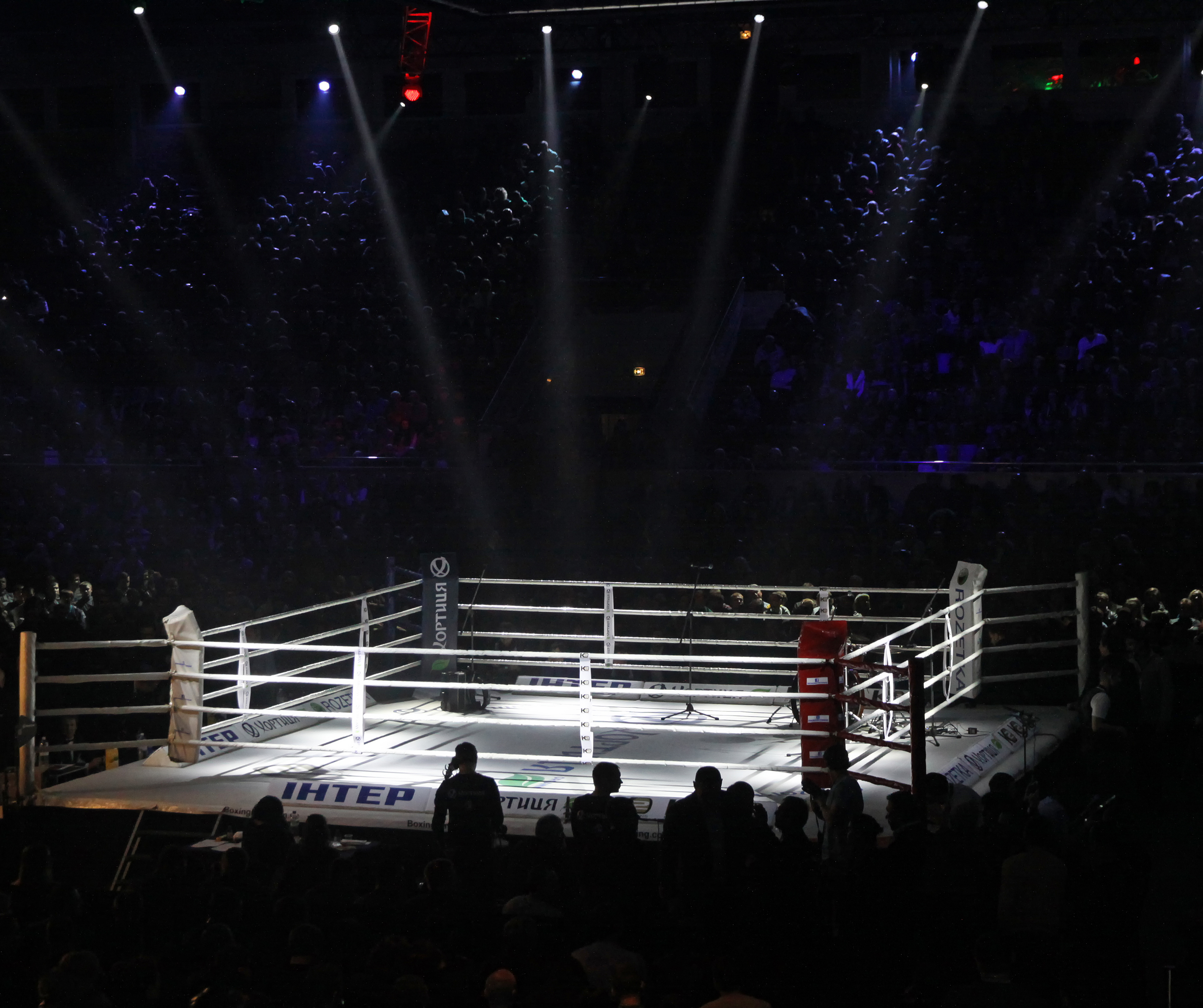 'What safety measures are taken in the boxing ring to protect fighters and officials?