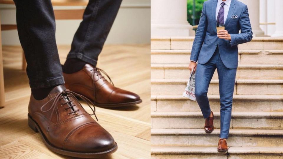 um homem descendo escadas usando um terno azul e um oxford marrom