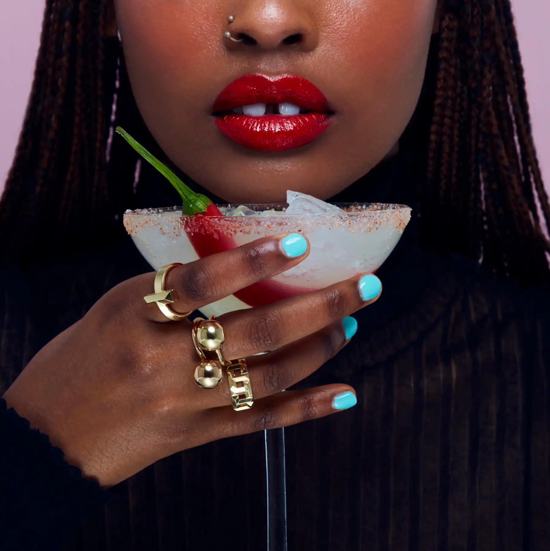 woman wearing rings with chilli cocktail