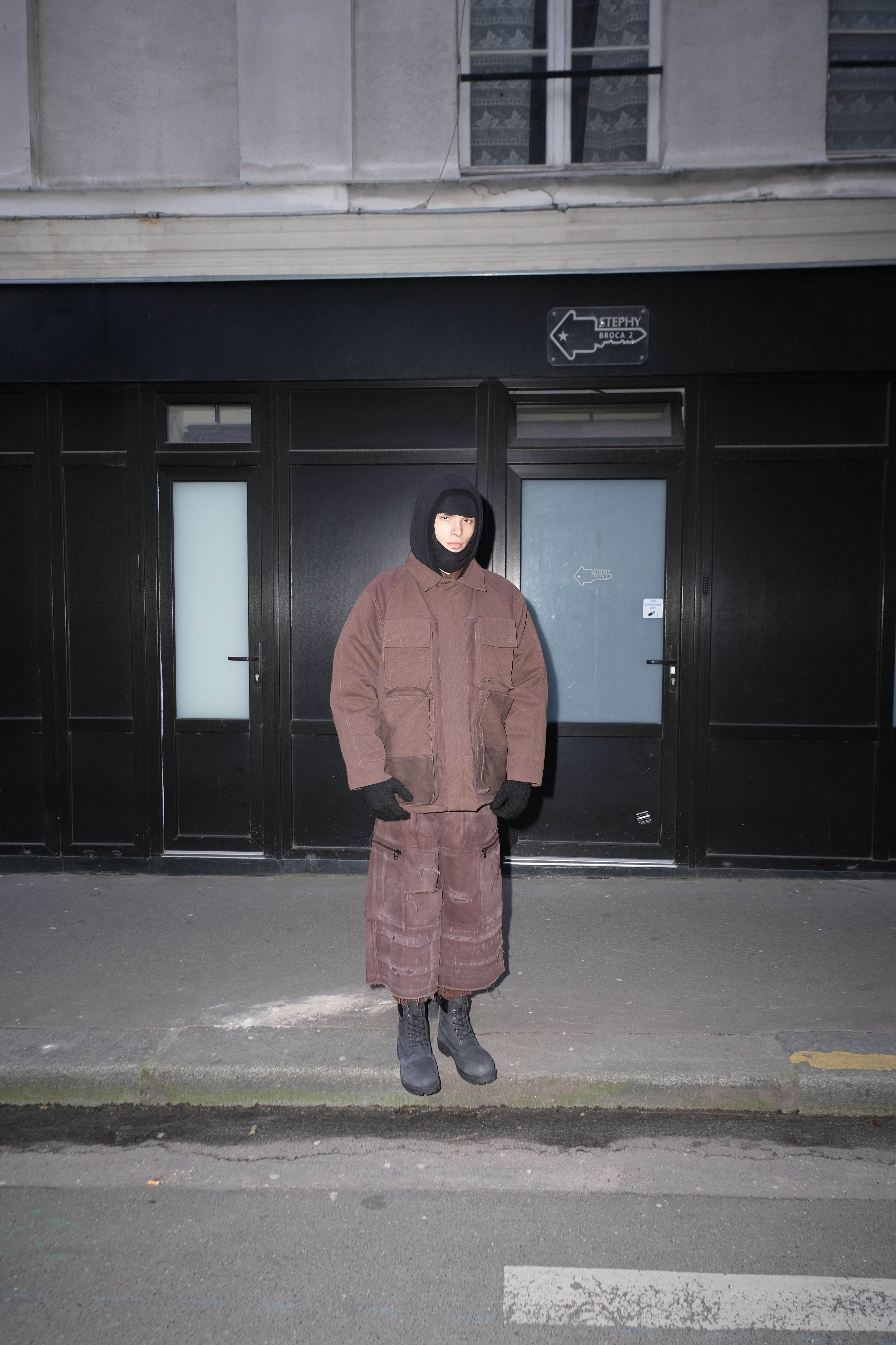 MK HOODIE, BROWN WORKER JACKET & DISTRESSED 3/4 UNIFORM TROUSERS