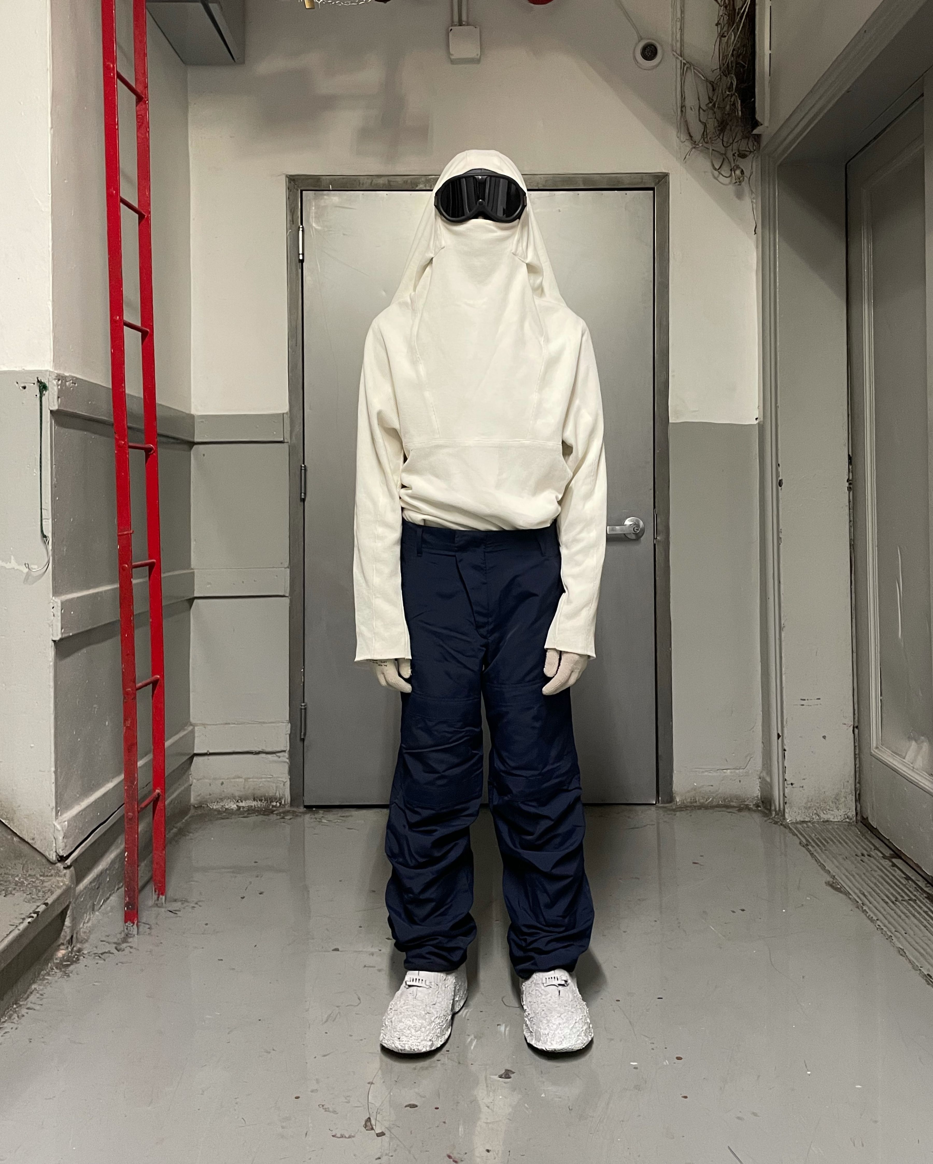 man wearing armstrong hoodie and cargo knee trousers from bryan jimenez spring summer 2022
