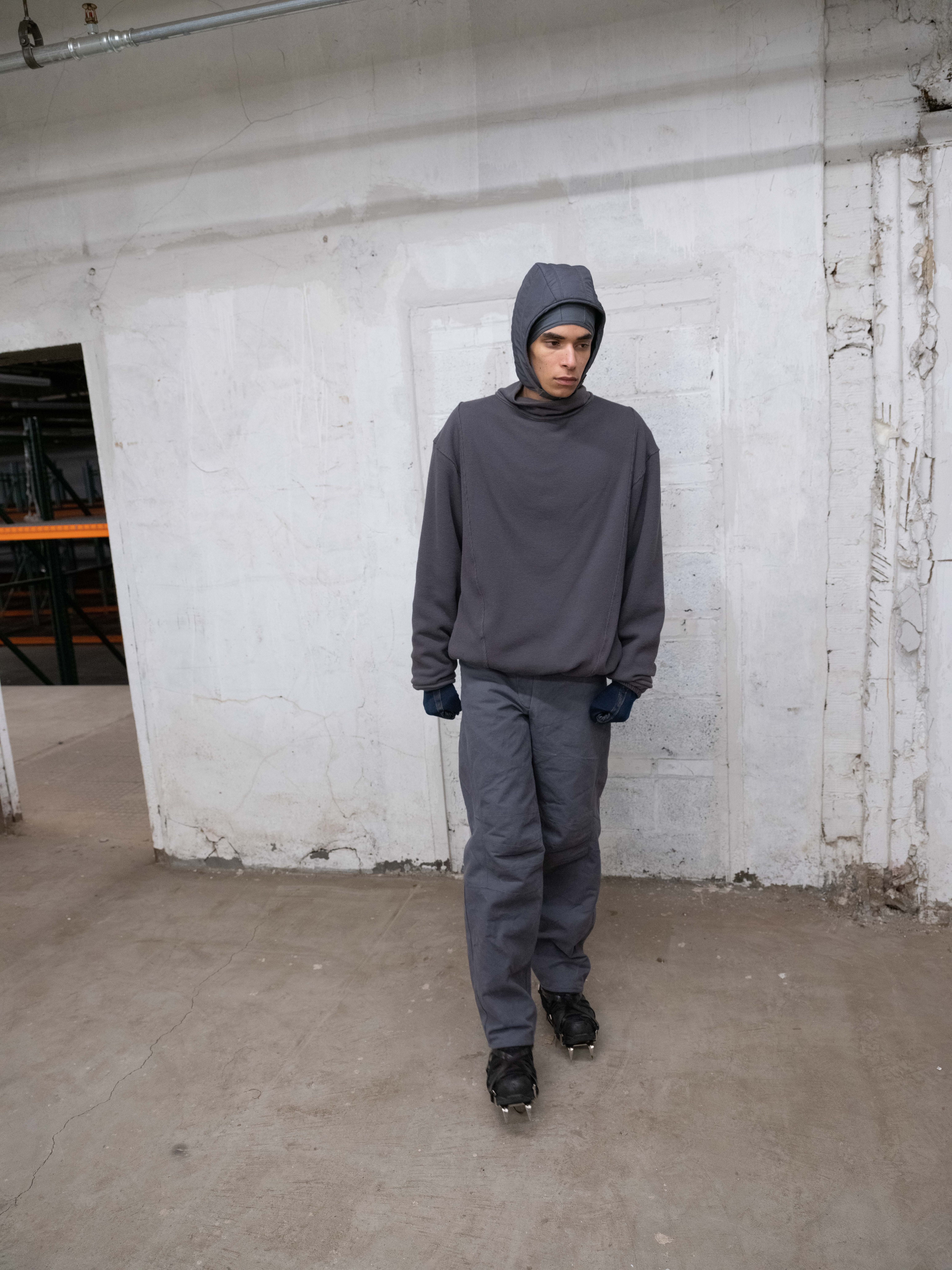 man wearing insulated headcap, skull cap, lunar trousers and insulated thermal from bryan jimenez fall/winter 2022