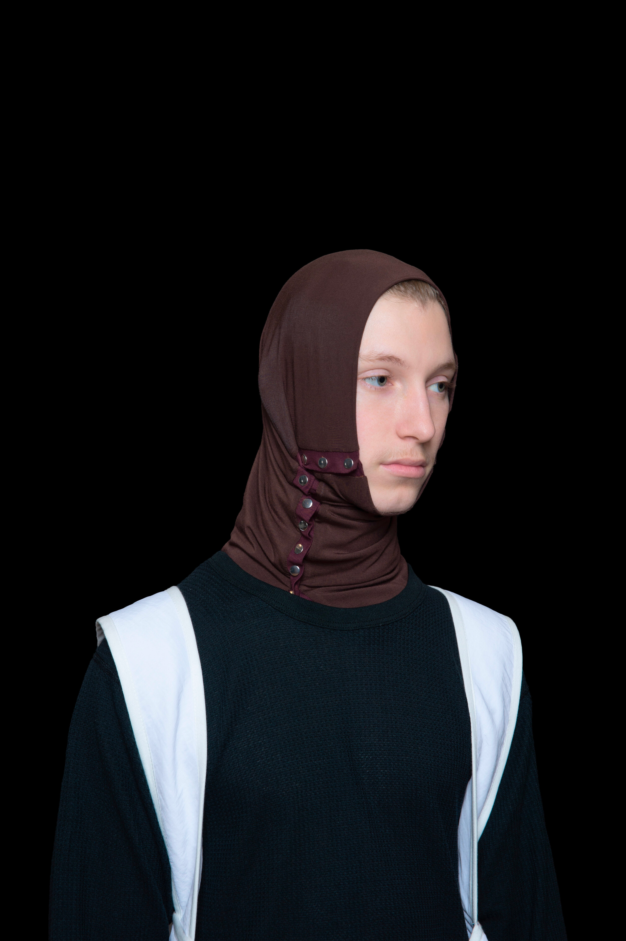 man wearing tactical head scarf, oxygen bag, and darted trousers from bryan jimenez fall winter 2020
