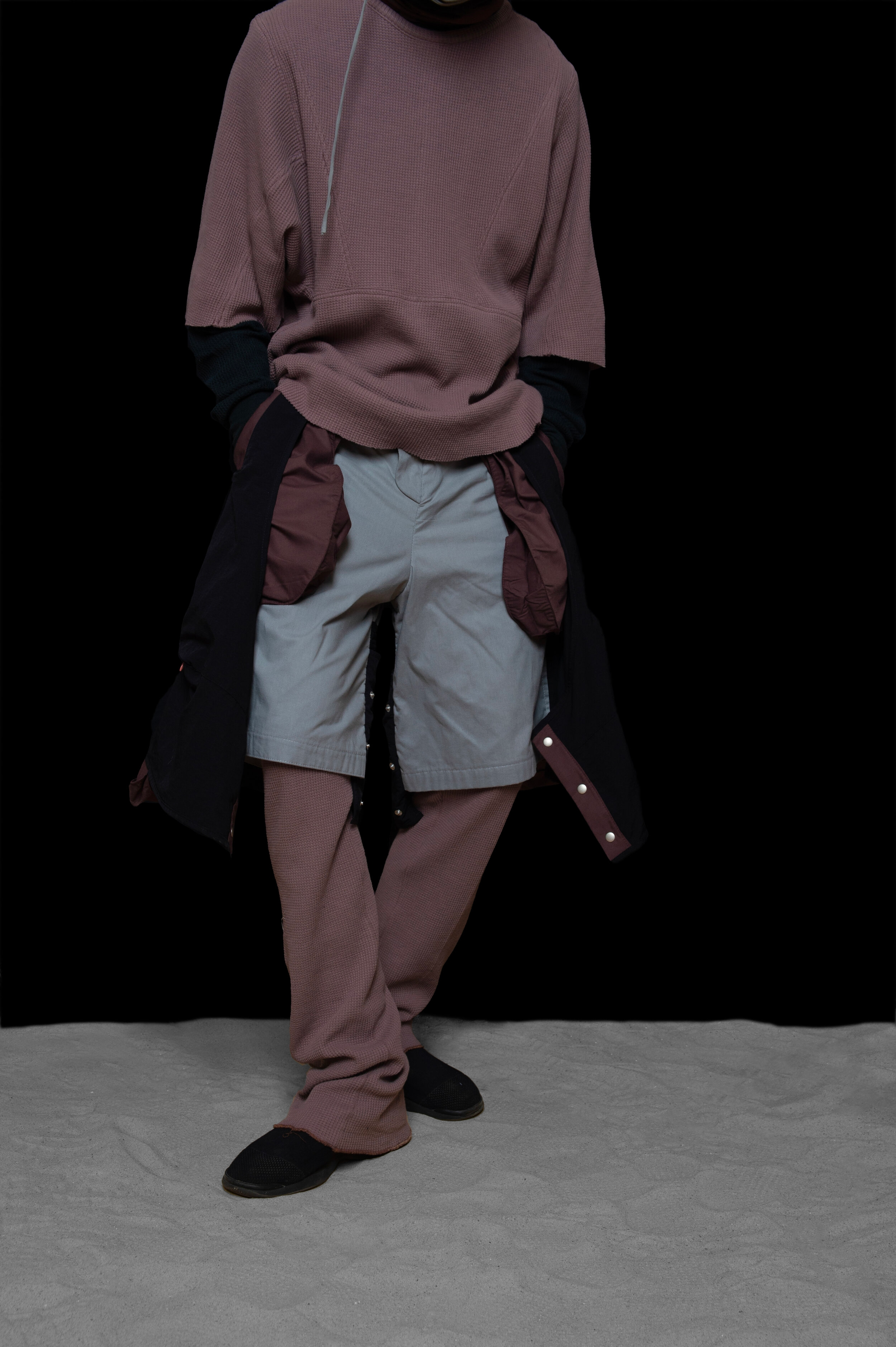man wearing head liner cap, short sleeve panel thermal, and multi layered trousers from bryan jimenez fall winter 2020 