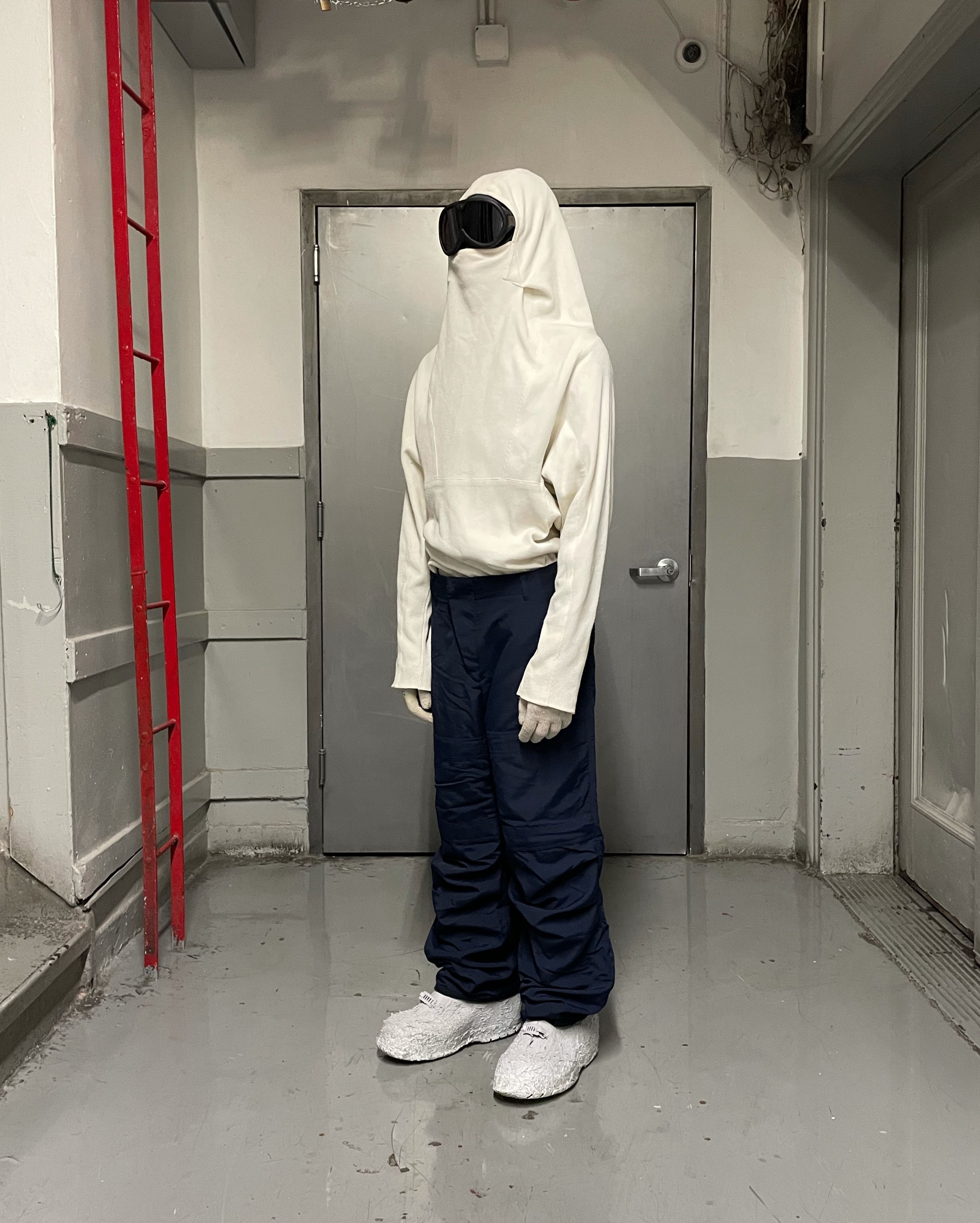man wearing armstrong hoodie and cargo knee trousers from bryan jimenez spring summer 2022