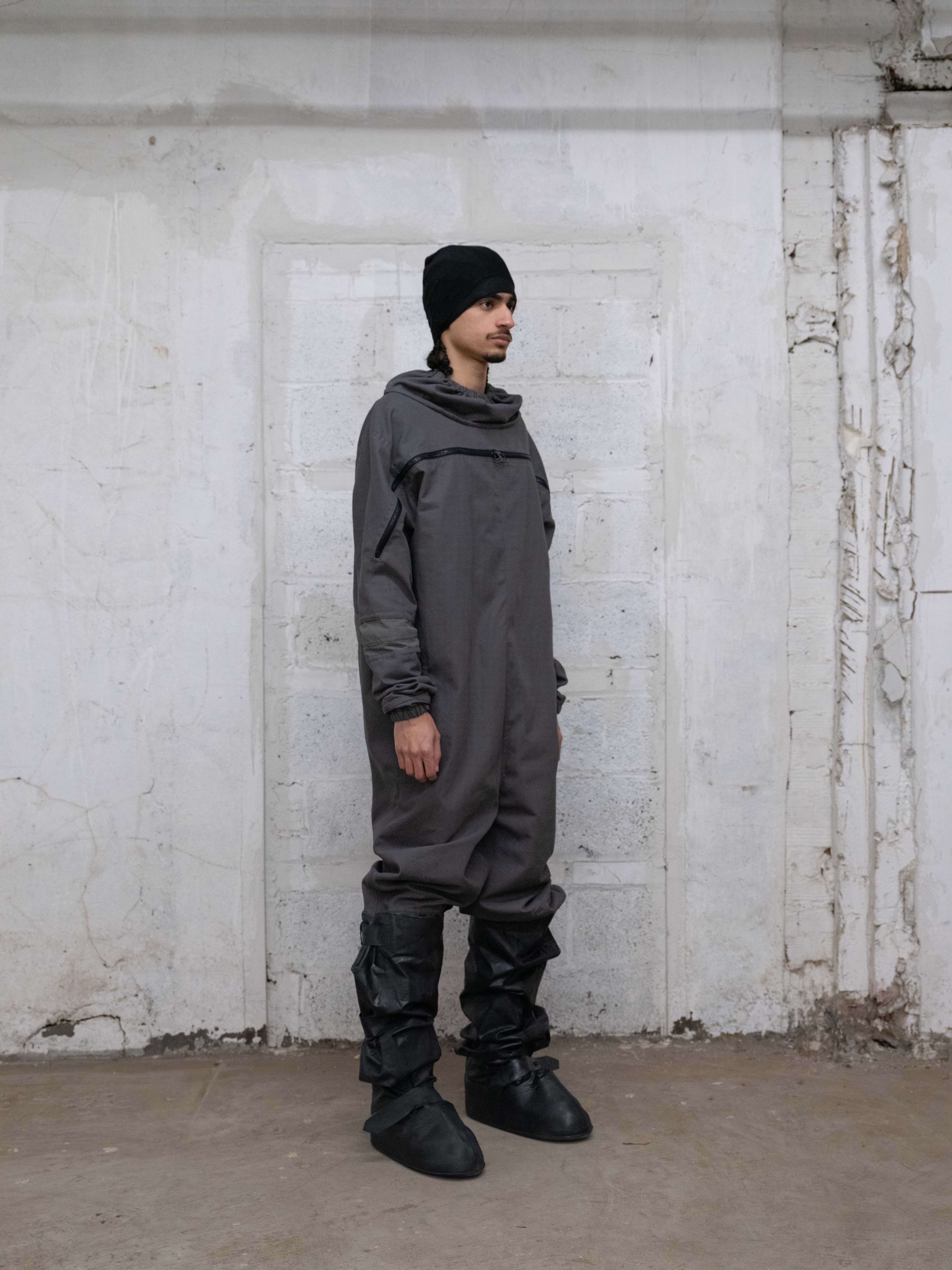 man wearing anti exposure suit, skull cap v2, and cover boots from bryan jimenez fall/winter 2022