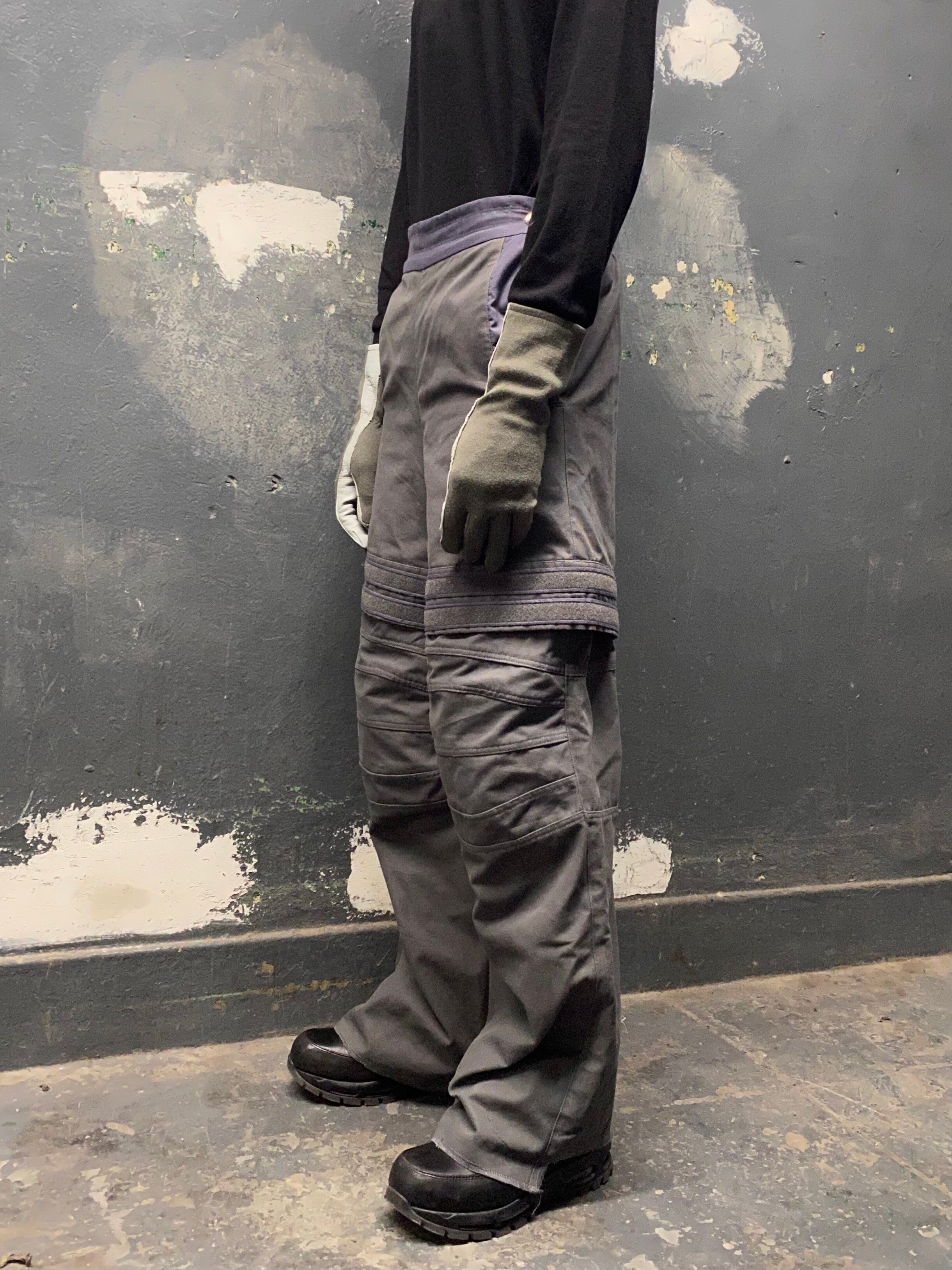 man wearing amu trousers v2 and silk weight top from bryan jimenez fall/winter 2022 