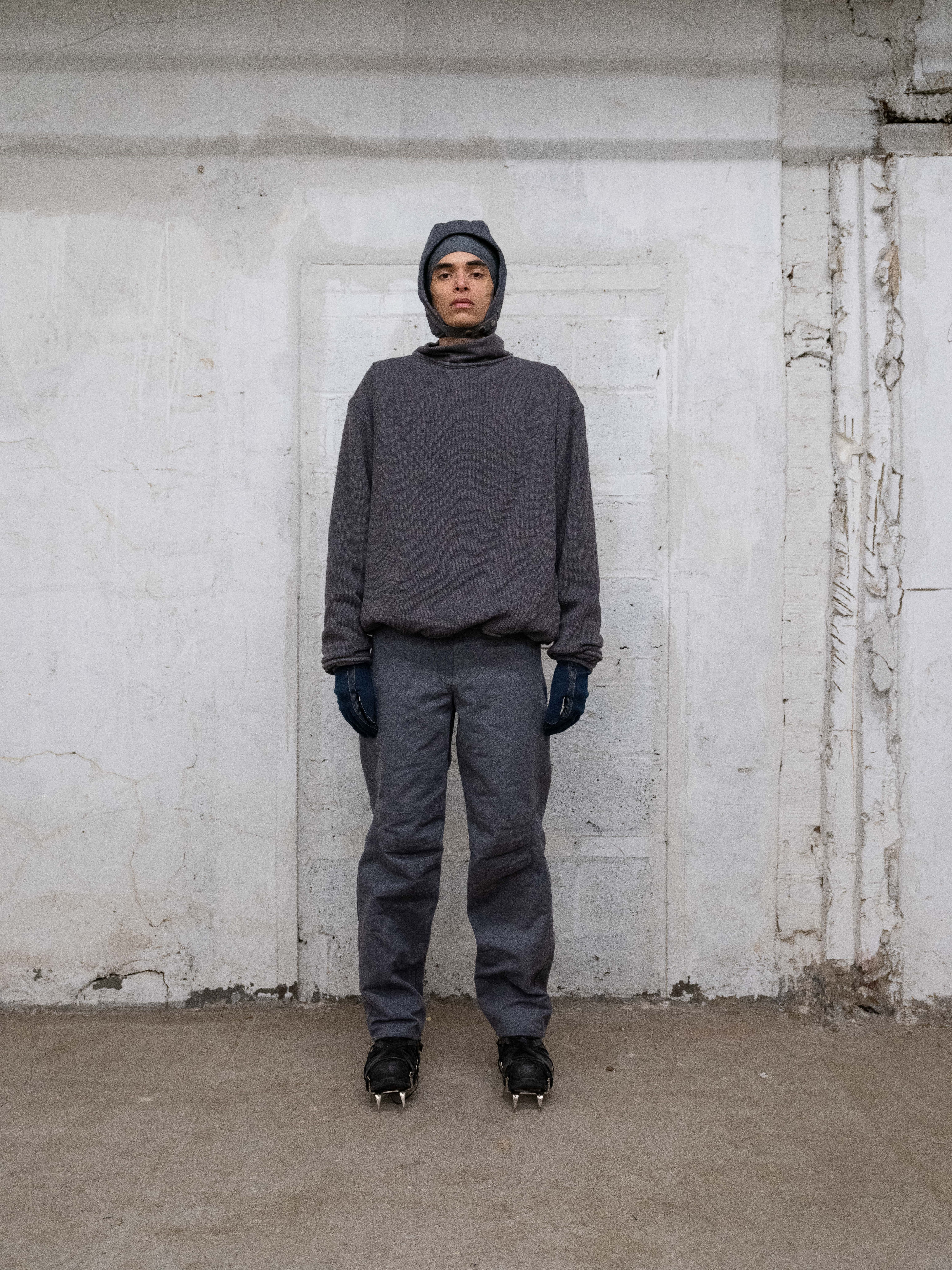 man wearing lunar trousers, insulated themal, skull cap, and insulated headcap from bryan jimenez fall/winter 2022