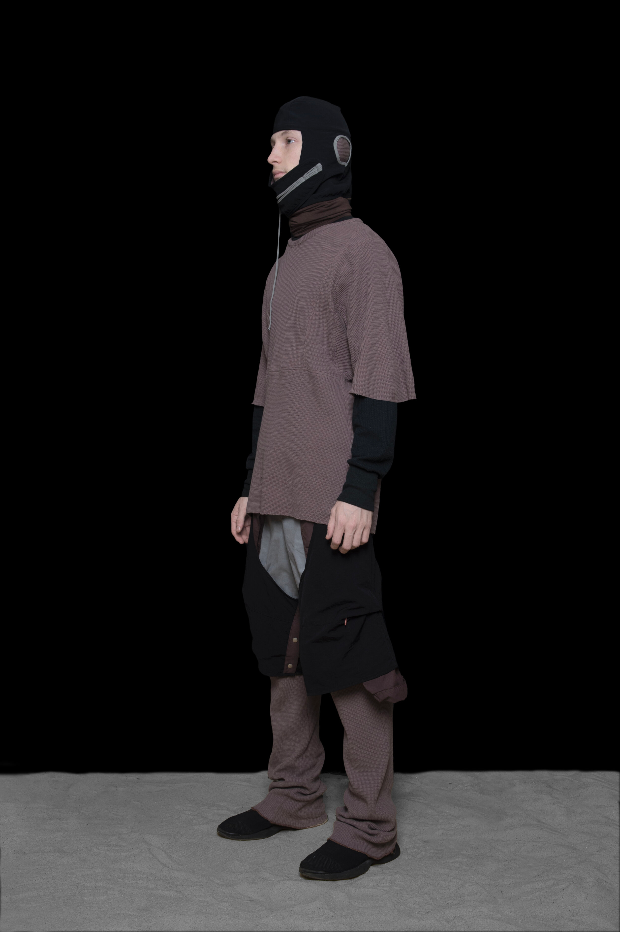 man wearing head liner cap, short sleeve panel thermal, and multi layered trousers from bryan jimenez fall winter 2020 