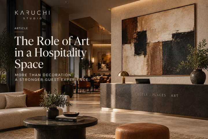 A hotel reception area with art behind the reception desk