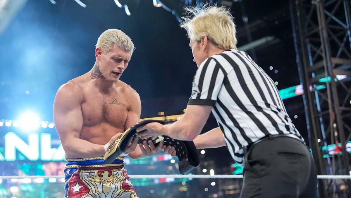 Cody Rhodes holding the Undisputed WWE Universal Championship aloft after defeating Roman Reigns at WrestleMania XL