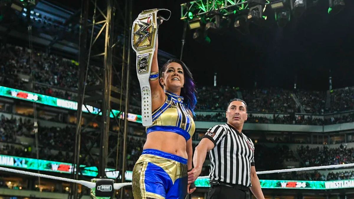 Bayley pointing to the crowd after winning the WWE Women's Championship at WrestleMania XL