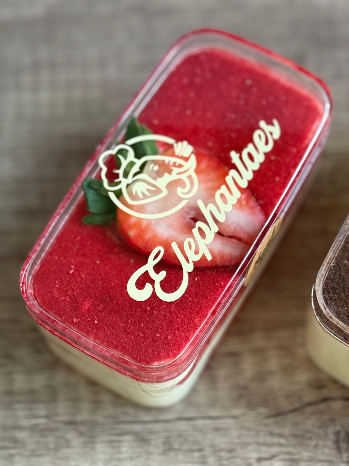 Strawberry tiramisu with strawberry slice and Elephantaes branded top
