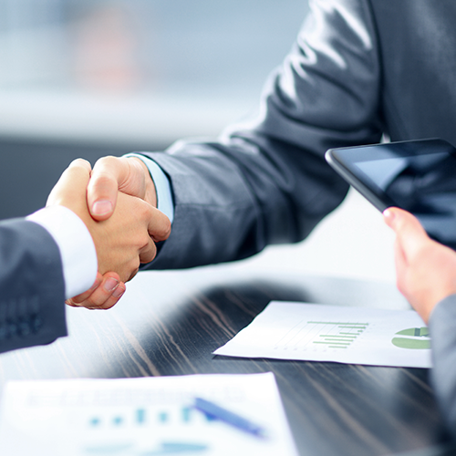 Business professionals greeting one another