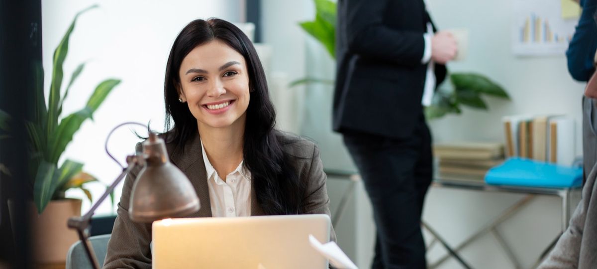Recruiter reviewing a candidate profile on a laptop