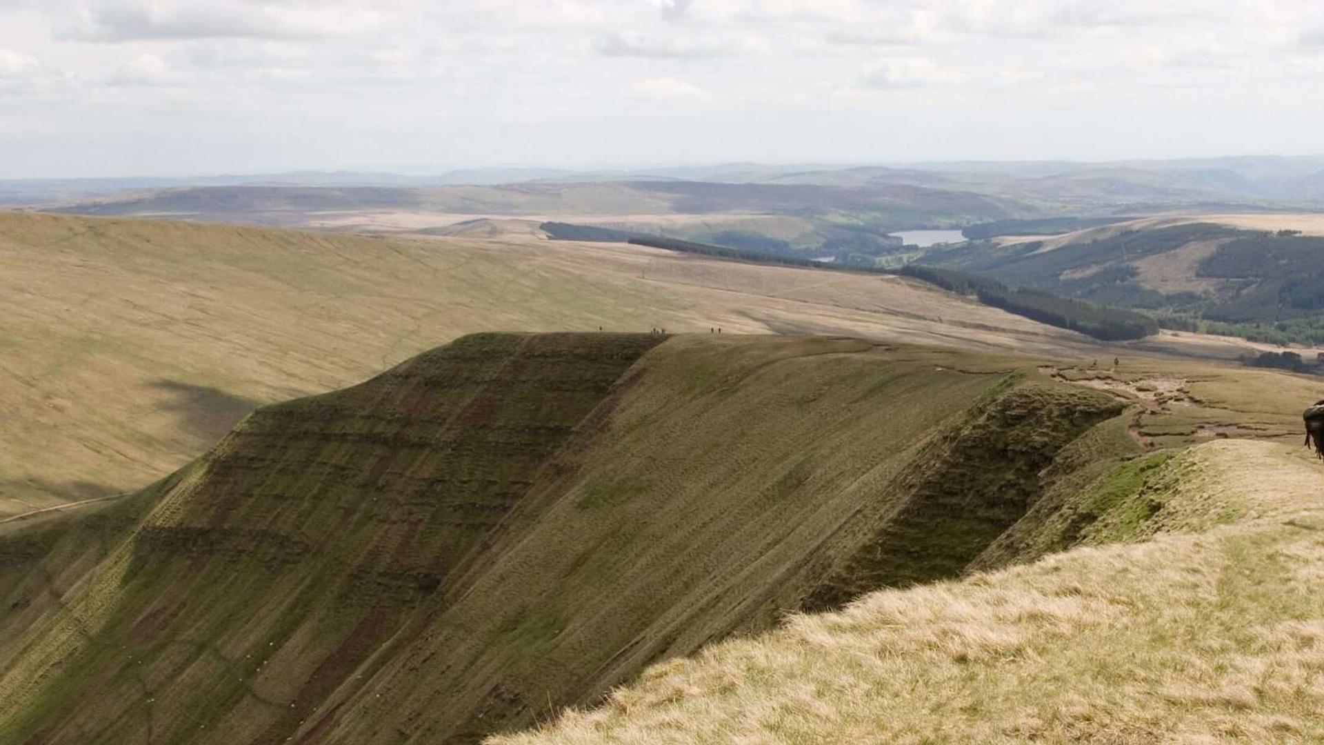 Man walking along Pen Y Fan Ridge