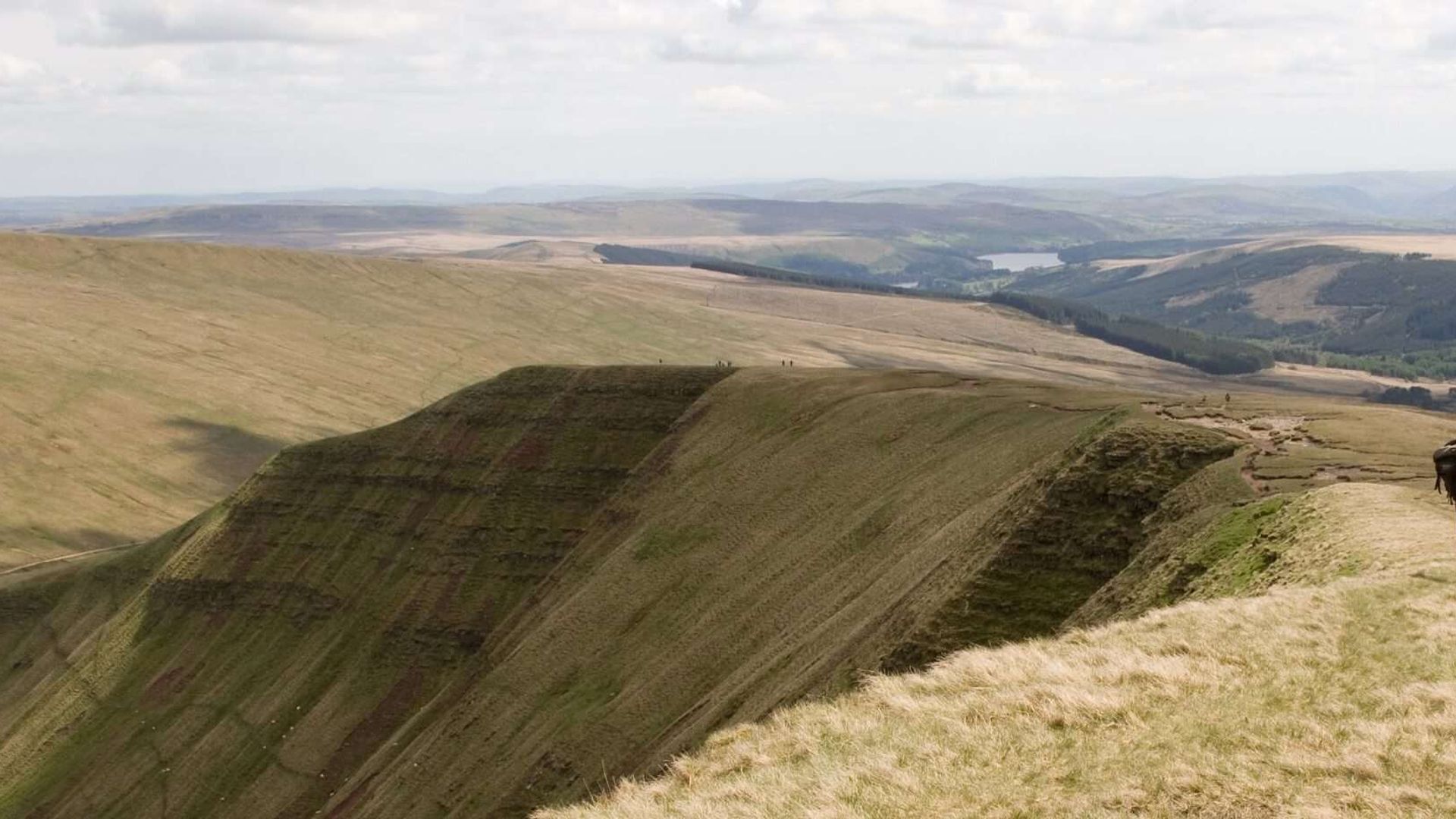 Man walking along Pen Y Fan Ridge