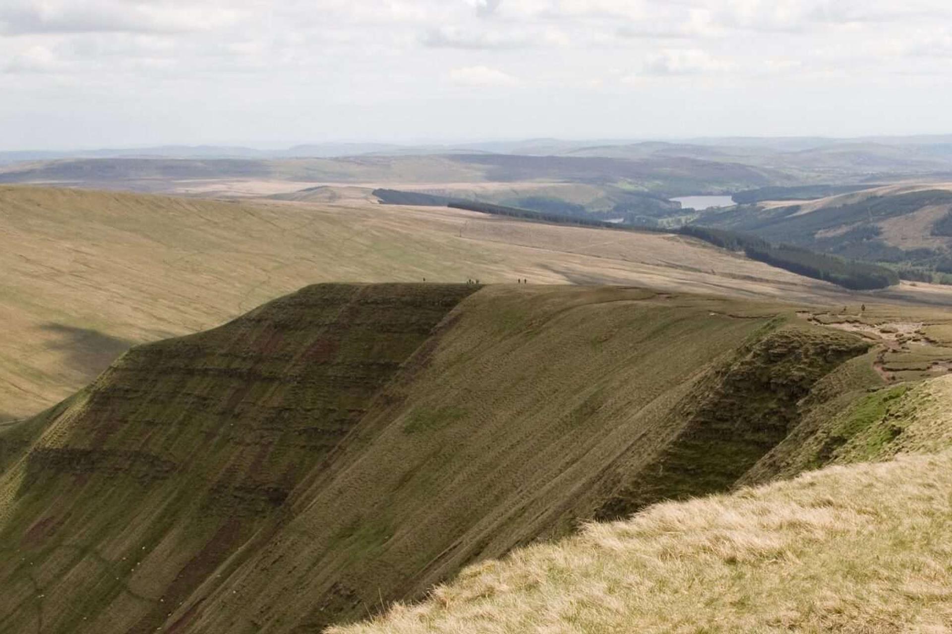 Man walking along Pen Y Fan Ridge