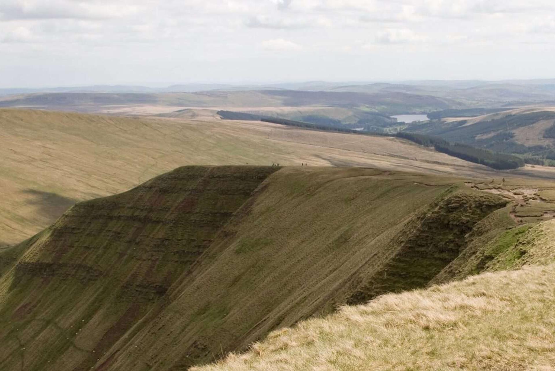 Man walking along Pen Y Fan Ridge