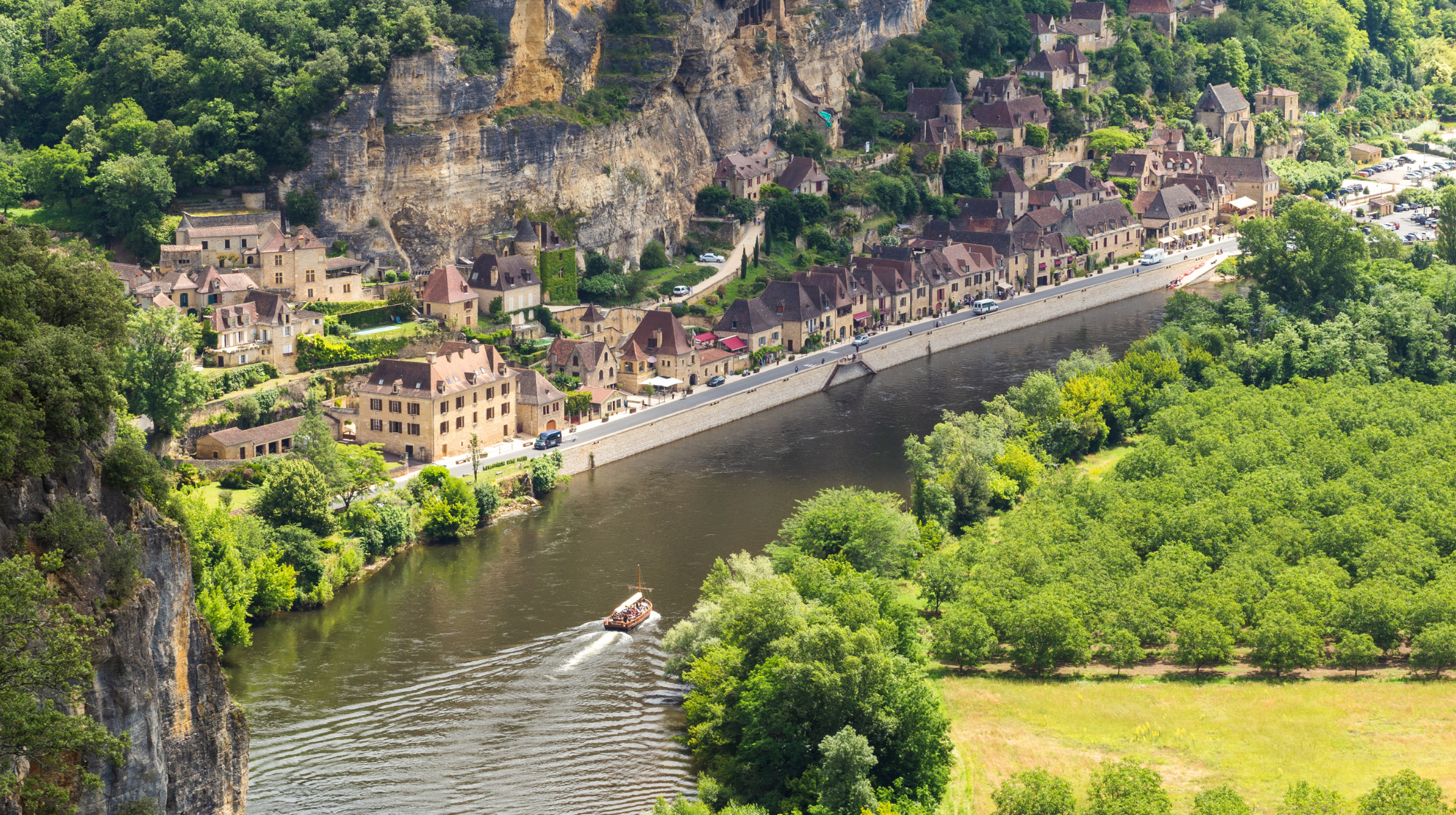 La Roque-Gageac beneath limestone cliffs beside the Dordogne River