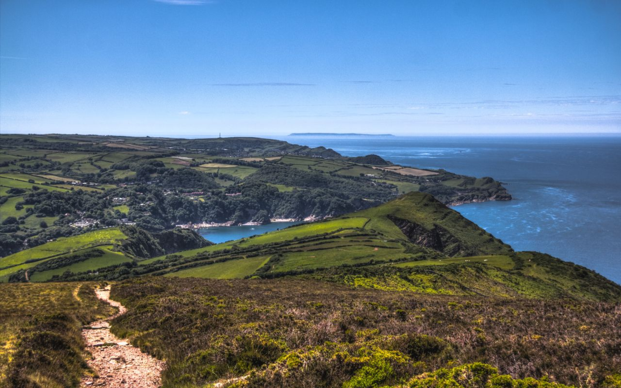 Path across Exmoor hills overlooking the North Devon coast and sea