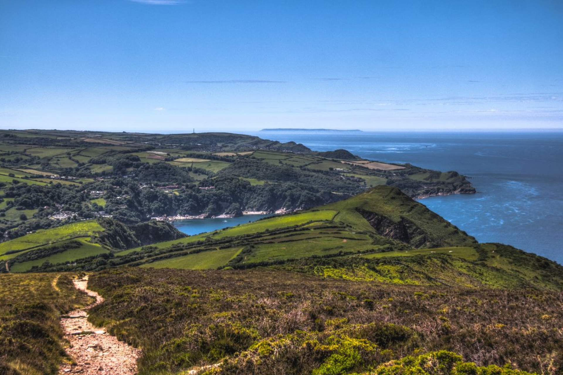 Path across Exmoor hills overlooking the North Devon coast and sea