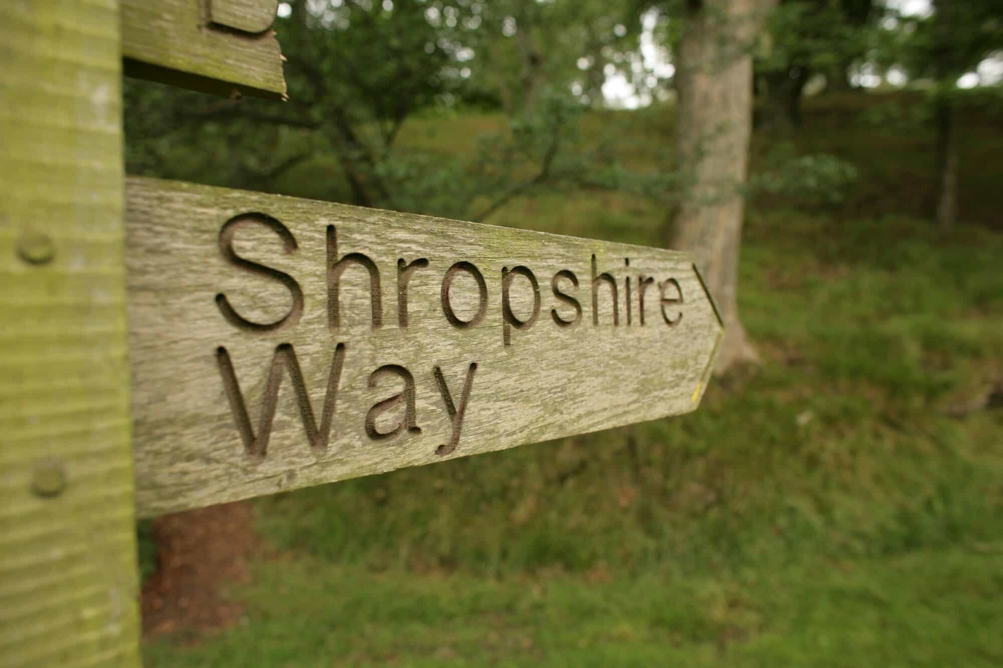 Wooden sign directing to the Shropshire Way
